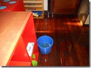 Catching the water in a bucket