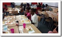 Rediet (white tee shirt) enjoying snack