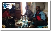 Haile, a cousin, and Bezou roasting coffee