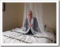Chri and the mozzie net. It goes over our whole bed, honest!