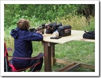 Chris with her weapons